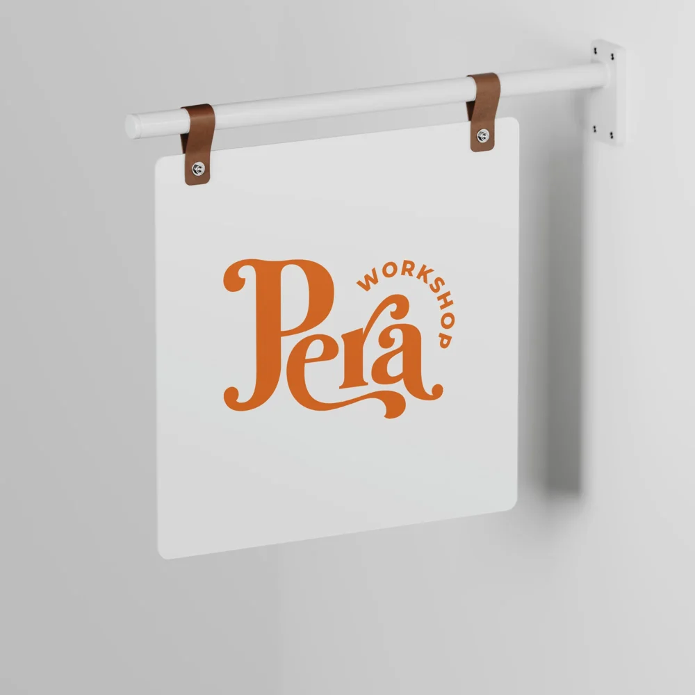 An image of the Custom White Hanging Signage product with a logo print. The product appears to be hanging on the wall.