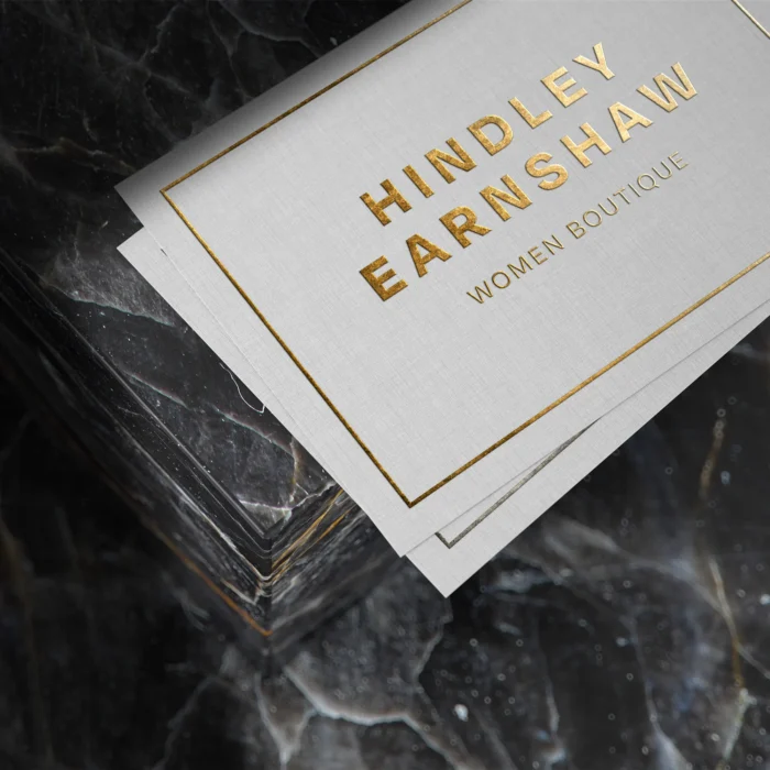 Foil Business Cards with a white design with gold leaf on a black background