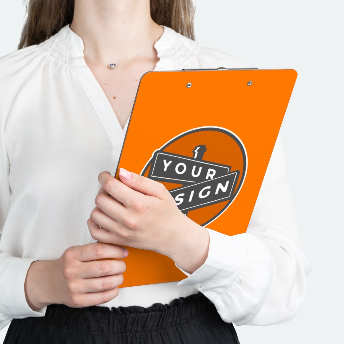 A colorful image of the Custom Design Clipboards product, including a person holding the product.