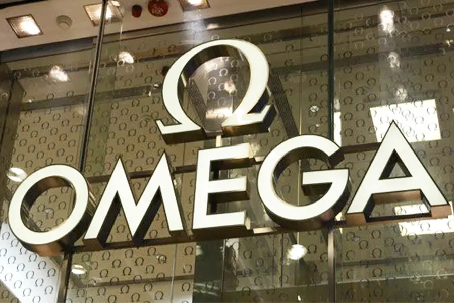 This image, which is the main image of Channel Letters Sign: All Types + 5 Bonuses, features Omega's front-lit channel letters sign. The sign has gold details and an acrylic surface.