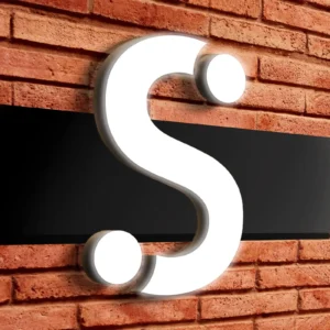 Photograph of a sign with a frontlit channel letter mounted on the raceway.