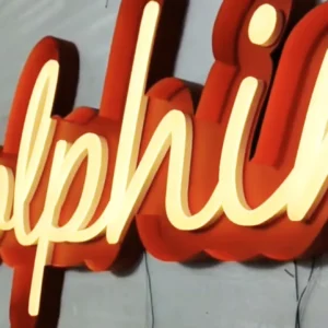 an open face channel letters sign made of red aluminum illuminated with warm white LEDs